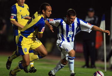 BRIGHTON, ENGLAND - OCTOBER 13: Nicky Forster of Brighton and Hove Albion avoids Josh Gowling of Gillingham during the Coca-Cola League One match between Brighton & Hove Albion and Gillingham at Withdean Stadium on October 13, 2009 in Brighton, England.  (Photo by Bryn Lennon/Getty Images)