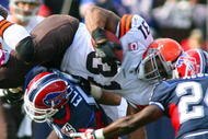 ORCHARD PARK, NY - OCTOBER 11:  Jamal Lewis #31 of the Cleveland Browns tries to jump over Keith Ellison #56 of the Buffalo Bills during their NFL game at Ralph Wilson Stadium on October 11, 2009 in Orchard Park, New York. The Browns defeated the Bills 6-3. (Photo by Rick Stewart/Getty Images)
