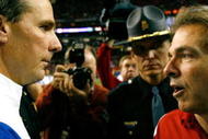 ATLANTA - DECEMBER 06:  Head coach Nick Saban of the Alabama Crimson Tide congratulates head coach Urban Meyer of the Florida Gators after the Gators 31-20 win in the SEC Championship on December 6, 2008 at the Georgia Dome in Atlanta, Georgia.  (Photo by Kevin C. Cox/Getty Images)