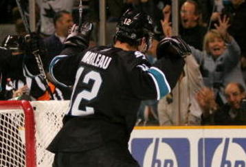 SAN JOSE, CA - DECEMBER 01:  Patrick Marleau #12 and Joe Thornton #19 of the San Jose Sharks celebrate after Marleau scored a goal on goalie Brian Elliott #30 of the Ottawa Senators at HP Pavilion on December 1, 2009 in San Jose, California.  (Photo by Ezra Shaw/Getty Images)