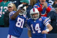 ORCHARD PARK, NY - NOVEMBER 29:  Terrell Owens #81 and Ryan Fitzpatrick #14 of the Buffalo Bills celebrate Fitzpatrick's 31 yard touchdown run against the Miami Dolphins at Ralph Wilson Stadium on November 29, 2009 in Orchard Park, New York.  (Photo by Rick Stewart/Getty Images)