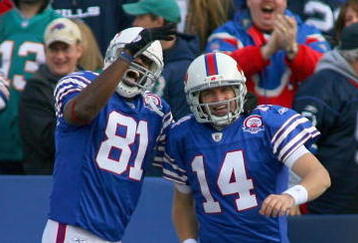 ORCHARD PARK, NY - NOVEMBER 29:  Terrell Owens #81 and Ryan Fitzpatrick #14 of the Buffalo Bills celebrate Fitzpatrick's 31 yard touchdown run against the Miami Dolphins at Ralph Wilson Stadium on November 29, 2009 in Orchard Park, New York.  (Photo by Rick Stewart/Getty Images)