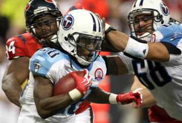 HOUSTON - NOVEMBER 23:  Running back Chris Johnson #28 of the Tennessee Titans carries the ball against the Houston Texans on November 23, 2009  at Reliant Stadium in Houston, Texas.  The Titans won 20-17.  (Photo by Stephen Dunn/Getty Images)