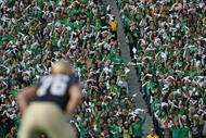 SOUTH BEND, IN - OCTOBER 17: Student fans of the Notre Dame Fighting Irish wave towels before a kick-off against the USC Trojans at Notre Dame Stadium on October 17, 2009 in South Bend, Indiana. USC defeated Notre Dame 34-27. (Photo by Jonathan Daniel/Getty Images)