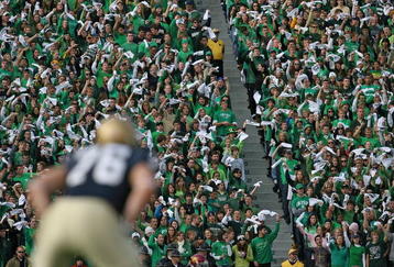 SOUTH BEND, IN - OCTOBER 17: Student fans of the Notre Dame Fighting Irish wave towels before a kick-off against the USC Trojans at Notre Dame Stadium on October 17, 2009 in South Bend, Indiana. USC defeated Notre Dame 34-27. (Photo by Jonathan Daniel/Getty Images)