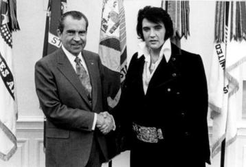 FILE PHOTO: President Richard Nixon meets with Elvis Presley December 21, 1970 at the White House. (Photo by National Archives)