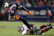DENVER - NOVEMBER 26:  Wide receiver Brandon Marshall #15 of the Denver Broncos makes a pass reception and is tackled by Terrell Thomas #24 of the New York Giants during NFL action at Invesco Field at Mile High on November 26, 2009 in Denver, Colorado.  (Photo by Doug Pensinger/Getty Images)