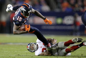 DENVER - NOVEMBER 26:  Wide receiver Brandon Marshall #15 of the Denver Broncos makes a pass reception and is tackled by Terrell Thomas #24 of the New York Giants during NFL action at Invesco Field at Mile High on November 26, 2009 in Denver, Colorado.  (Photo by Doug Pensinger/Getty Images)