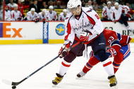 MONTREAL- NOVEMBER 28: Alex Ovechkin #8 of the Washington Capitals skates with the puck while being defended by Ryan White #53 of the Montreal Canadiens during the NHL game on November 28, 2009 at the Bell Centre in Montreal, Quebec, Canada. The Capitals defeated the Canadiens 4-3 in a shootout. (Photo by Richard Wolowicz/Getty Images)