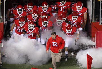 PISCATAWAY, NJ - NOVEMBER 12:  Head coach Greg Schiano of the Rutgers Scarlet Knights leads his team on the field to play against the South Florida Bulls at Rutgers Stadium on November 12, 2009 in Piscataway, New Jersey.  (Photo by Jim McIsaac/Getty Images)