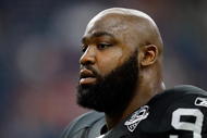 HOUSTON - OCTOBER 04:  Defensive end Tommy Kelly #93 of the Oakland Raiders at Reliant Stadium on October 4, 2009 in Houston, Texas.  (Photo by Ronald Martinez/Getty Images)