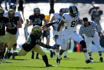 BOULDER, CO - OCTOBER 31:  Wide reciever Danario Alexander #81 of the Missouri Tigers eludes safety Ray Polk #26 of the Colorado Buffaloes and goes 73 yards for a first quarter touchdown reception at Folsom Field on October 31, 2009 in Boulder, Colorado.  (Photo by Doug Pensinger/Getty Images)
