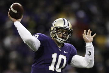 SEATTLE - NOVEMBER 28:  Quarterback Jake Locker #10 of the Washington Huskies passes against the Washington State Cougars on November 28, 2009 at Husky Stadium in Seattle, Washington. The Huskies defeated the Cougars 30-0. (Photo by Otto Greule Jr/Getty Images)