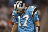 CHARLOTTE - NOVEMBER 19: Jake Delhomme #17 of the Carolina Panthers stabds on the field with his head down against the Miami Dolphins at Bank of America Stadium on November 19, 2009 in Charlotte, North Carolina. (Photo by Streeter Lecka/Getty Images)