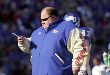LAWRENCE, KS - NOVEMBER 18:  Mark Mangino  of the Kansas Jayhawks stands on the field during the game against the Kansas State Wildcats on November 18, 2006 at Memorial Stadium in Lawrence, Kansas.  Kansas won 39-20.  (Photo by Brian Bahr/Getty Images)