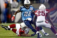 NASHVILLE, TN - NOVEMBER 29: Teammates Alan Branch #78 and Bryant McFadden #25 of the Arizona Cardinals try to tackle Chris Johnson #28 of the Tennessee Titans during their game at LP Field on November 29, 2009 in Nashville, Tennessee. (Photo by Streeter Lecka/Getty Images)