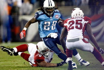 NASHVILLE, TN - NOVEMBER 29:  Teammates Alan Branch #78 and Bryant McFadden #25 of the Arizona Cardinals try to tackle Chris Johnson #28 of the Tennessee Titans during their game at LP Field on November 29, 2009 in Nashville, Tennessee.  (Photo by Streeter Lecka/Getty Images)