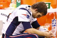NEW ORLEANS - NOVEMBER 30: Quarterback Tom Brady #12 of the New England Patriots sits dejected on the bench late in the fourth quarter against the New Orleans Saints at Louisana Superdome on November 30, 2009 in New Orleans, Louisiana. (Photo by Scott Halleran/Getty Images)