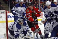 CHICAGO - NOVEMBER 13: Patrick Sharp #10 of the Chicago Blackhawks tries to control the puck in front of Vesa Toskala #35 of the Toronto Maple Leafs as Rickard Wallin #51, Lee Stempniak #12 and Francois Beauchemin #22 defend at the United Center on November 13, 2009 in Chicago, Illinois. (Photo by Jonathan Daniel/Getty Images)