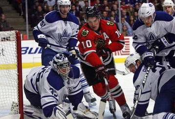 CHICAGO - NOVEMBER 13: Patrick Sharp #10 of the Chicago Blackhawks tries to control the puck in front of Vesa Toskala #35 of the Toronto Maple Leafs as Rickard Wallin #51, Lee Stempniak #12 and Francois Beauchemin #22 defend at the United Center on November 13, 2009 in Chicago, Illinois. (Photo by Jonathan Daniel/Getty Images)