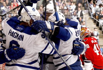 TORONTO - NOVEMBER 21:  Niklas Hagman #9, Jason Blake #55 and Carl Gunnarsson #36 of the Toronto Maple Leafs celebrate goal against the Washington Capitals during game action November 21, 2009 at the Air Canada Centre in Toronto, Ontario, Canada. (Photo by Abelimages/Getty Images)