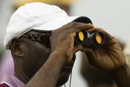 CHARLESTON, SC - OCTOBER 24: A fan uses a pair of binoculars to keep an eye on action on the first hole during the third round of the Nationwide Tour Championship at Daniel Island on October 24, 2009 in Charleston, South Carolina. (Photo by Chris Keane/Getty Images)