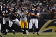 BALTIMORE - NOVEMBER 29:  LaMarr Woodley #56 of the Pittsburgh Steelers defends against the Baltimore Ravens at M&T Bank Stadium on November 29, 2009 in Baltimore, Maryland. The Ravens defeated the Steelers 20-17. (Photo by Larry French/Getty Images)