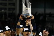 NEW YORK - NOVEMBER 04:  Robinson Cano #24 of the New York Yankees celebrates with the trophy after their 7-3 win against the Philadelphia Phillies in Game Six of the 2009 MLB World Series at Yankee Stadium on November 4, 2009 in the Bronx borough of New York City.  (Photo by Chris McGrath/Getty Images)