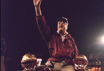 1 Jan 1996:  Head coach Bobby Bowden of the Florida State Seminoles is carried triumphantly off the field by nose guard Andre Wadsworth #8 and tackle Orpheus Roy after defeating the Notre Dame Fighting Irish in the Orange Bowl in Miami, Florida 31-26.  Ma
