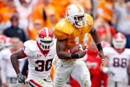 KNOXVILLE, TN - OCTOBER 10: Eric Berry #14 of the Tennessee Volunteers runs with the ball after intercepting a pass during the SEC game against the Georgia Bulldogs at Neyland Stadium on October 10, 2009 in Knoxville, Tennessee. (Photo by Andy Lyons/Getty Images)