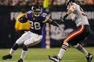 MINNEAPOLIS - NOVEMBER 29:  Adrian Peterson #28 of the Minnesota Vikings carries the ball as Hunter Hillenmeyer #92 of the Chicago Bears defends on November 29, 2009 at Hubert H. Humphrey Metrodome in Minneapolis, Minnesota. The Vikings defeated the Bears 36-10.  (Photo by Elsa/Getty Images)