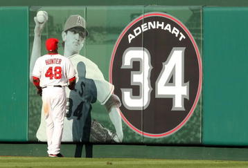 ANAHEIM, CA - OCTOBER 19:  Torii Hunter #48 of the Los Angeles Angels of Anaheim looks up at the Nick Adenhart display during the game against the New York Yankees in Game Three of the ALCS during the 2009 MLB Playoffs at Angel Stadium on October 19, 2009 in Anaheim, California.  (Photo by Stephen Dunn/Getty Images)