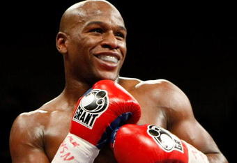 LAS VEGAS - SEPTEMBER 19:  Floyd Mayweather Jr. smiles in the ring during his fight against Juan Manuel Marquez at the MGM Grand Garden Arena September 19, 2009 in Las Vegas, Nevada. Mayweather won by unanimous decision.  (Photo by Ethan Miller/Getty Images)