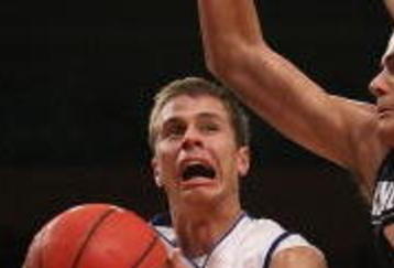 NEW YORK - NOVEMBER 27:  Jon Scheyer #30 of the Duke Blue Devils lays the ball up under Gavin Edwards #33 of the Connecticut Huskies during the Championship game at Madison Square Garden on November 27, 2009 in New York, New York.  (Photo by Nick Laham/Getty Images)