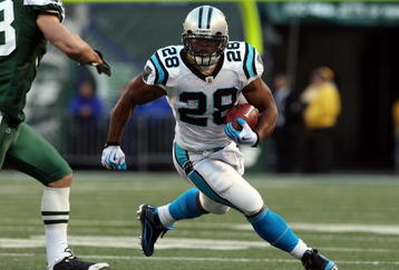 EAST RUTHERFORD, NJ - NOVEMBER 29:  Jonathan Stewart #28 of the Carolina Panthers runs the ball against the New York Jets on November 29, 2009 at Giants Stadium in East Rutherford, New Jersey. The Jets defeated the Panthers 17-6.  (Photo by Jim McIsaac/Getty Images)