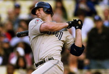 LOS ANGELES - JUNE 10:  Kevin Kouzmanoff #5 of the San Diego Padres hits an infield single for an RBI in the first inning against the Los Angeles Dodgers on June 10, 2009 at Dodger Stadium in Los Angeles, California.  (Photo by Stephen Dunn/Getty Images)