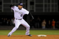 DENVER - OCTOBER 12: Yorvit Torrealba #8 of the Colorado Rockies celebrates his go ahead RBI double against the Philadelphia Phillies to give the Rockies a 4-2 lead in the bottom of the eighth inning in Game Four of the NLDS during the 2009 MLB Playoffs at Coors Field on October 12, 2009 in Denver, Colorado. (Photo by Doug Pensinger/Getty Images)