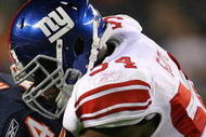 CHICAGO - AUGUST 22: Brandon  Rideau #84 of the Chicago Bears is tackled by Jonathan Goff #54 of the New York Giants during a pre-season game on August 22, 2009 at Soldier Field in Chicago, Illinois. The Bears defeated the Giants 17-3. (Photo by Jonathan Daniel/Getty Images)
