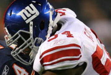CHICAGO - AUGUST 22: Brandon  Rideau #84 of the Chicago Bears is tackled by Jonathan Goff #54 of the New York Giants during a pre-season game on August 22, 2009 at Soldier Field in Chicago, Illinois. The Bears defeated the Giants 17-3. (Photo by Jonathan Daniel/Getty Images)