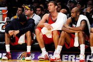 LOS ANGELES, CA - NOVEMBER 29:  Devin Harris (L) Brook Lopez (C) and Trenton Hassell of the New Jersey Nets reacts after a missed shot by a teammate in the closing minutes of the basketball game against the Los Angeles Lakers at Staples Center on November 29, 2009 in Los Angeles, California. The Nets tied for the worst start to an NBA season with their 17th straight loss. NOTE TO USER: User expressly acknowledges and agrees that, by downloading and/or using this Photograph, user is consenting to the terms and conditions of the Getty Images License Agreement.  (Photo by Kevork Djansezian/Getty Images)