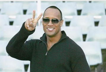 SYDNEY, AUSTRALIA- AUGUST 5:  Actor Dwayne Johnson 'The Rock' arrives to receive the Australian Rugby League official 'Kangaroo' Jersey from a selection of national players at the Aussie Stadium on August 5, 2004 in Sydney, Australia. (Photo by Patrick Riviere/Getty Images)