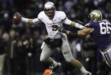 SEATTLE - NOVEMBER 28:  Quarterback Kevin Lopina #9 of the Washington State Cougars scrambles against Daniel Te'o-Nesheim #66 of the Washington Huskies on November 28, 2009 at Husky Stadium in Seattle, Washington. The Huskies defeated the Cougars 30-0. (Photo by Otto Greule Jr/Getty Images)