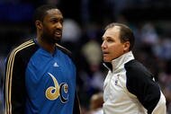 DALLAS - OCTOBER 27:  Guard Gilbert Arenas #0 of the Washington Wizards talks with NBA referee Ron Garretson #10 during the season opener on October 27, 2009 at American Airlines Center in Dallas, Texas.  NOTE TO USER: User expressly acknowledges and agrees that, by downloading and/or using this Photograph, user is consenting to the terms and conditions of the Getty Images License Agreement.  (Photo by Ronald Martinez/Getty Images)
