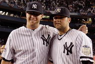 NEW YORK - SEPTEMBER 21: Phil Hughes #65 (L) and Joba Chamberlain #62 of the New York Yankees pose for a photograph after the last regular season game at Yankee Stadium on September 21, 2008 in the Bronx borough of New York City. The Yankees are playing their final season in the 85 year old ball park and plan on moving into the new Yankee Stadium across the street to start the 09 season. (Photo by Jim McIsaac/Getty Images)