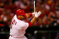 ST. LOUIS, MO - OCTOBER 10: Albert Pujols #5 of the St. Louis Cardinals hits an RBI single against Los Angeles in the eighth inning of Game Three of the NLDS during the 2009 MLB Playoffs at Busch Stadium on October 10, 2009 in St. Louis, Missouri. (Photo by Dilip Vishwanat/Getty Images)