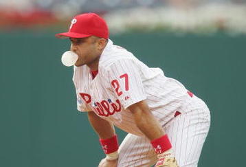 PHILADELPHIA - JULY 1:  Infielder Placido Polanco #27 of the Philadelphia Phillies blows a bubble during the game against the Montreal Expos at Citizens Bank Park on July 1, 2004 in Philadelphia, Pennsylvania.  The Phillies defeated the Expos 10-5.  (Photo by Jamie Squire/Getty Images)