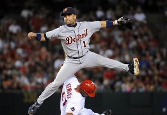 ANAHEIM, CA - AUGUST 25:  Placido Polanco #14 of the Detroit Tigers turns a double play on Howie Kendrick #47 of the Los Angeles Angels of Anaheim during the sixth inning at Angel Stadium of Anaheim on August 25, 2009 in Anaheim, California.  (Photo by Harry How/Getty Images)