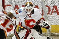 TORONTO, ON - NOVEMBER 14:  Miikka Kiprusoff #34 gets set to stop a shot by teammate Jarome Iginla #12 of the Calgary Flames in the pre game warm-up prior to a game against the Toronto Maple Leafs on November 14,2009 at the Air Canada Centre in Toronto, Ontario. The Flames won 5-2. (Photo by Claus Andersen/Getty Images) 