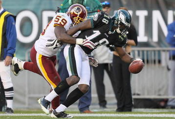 PHILADELPHIA - NOVEMBER 29:  Jeremy Maclin #18 of the Philadelphia Eagles makes a catch and is pushed out of bounds by London Fletcher #59  of the Washington Redskins during their game at Lincoln Financial Field on November 29, 2009 in Philadelphia, Pennsylvania.  (Photo by Al Bello/Getty Images)