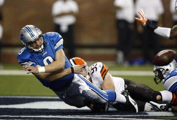 DETROIT, MI - NOVEMBER 22: Matthew Stafford #9 of the Detroit Lions tries to pass the football before being sacked in the end zone against Jason Trusnik #93 the Cleveland Browns at Ford Field on November 22, 2009 in Detroit, Michigan. Stafford was called for intentional grounding resulting in a safety for the Browns. The Lions came from behind to defeat the Browns 38-37. (Photo by Joe Robbins/Getty Images)